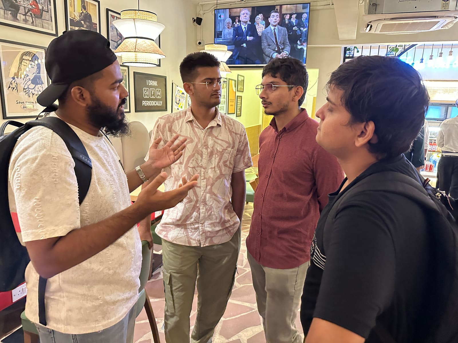 A standing conversation after the pitch, hands mid-gesture